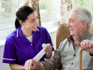 carer smiling with a service user