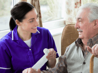 carer smiling with a service user