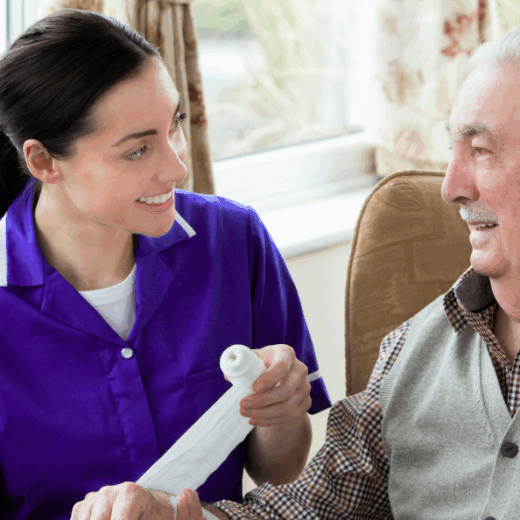 carer smiling with a service user