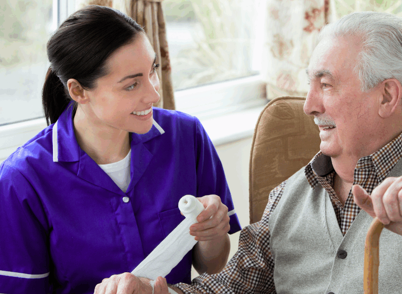 carer smiling with a service user